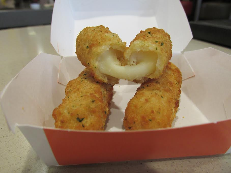 Illustration for article titled Fast-Food Smackdown: McDonald's Mozzarella Sticks Vs. Wendy's Bacon Fondue Fries